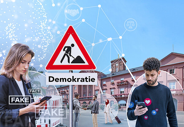 Eine Frau und ein Mann mit Mobiltelefon in der Hand stehen vor dem Rathaus. Zwischen Ihnen steht ein Baustelleschild mit dem Schriftzug „Demokratie". Um die Personen schwebt das Wort „Fake“. 